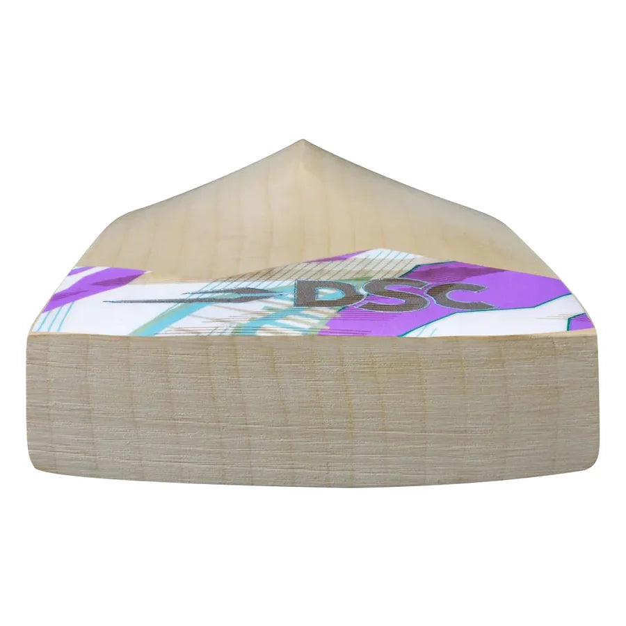 Player holding Cynos 1010 English Willow Cricket Bat on cricket pitch
