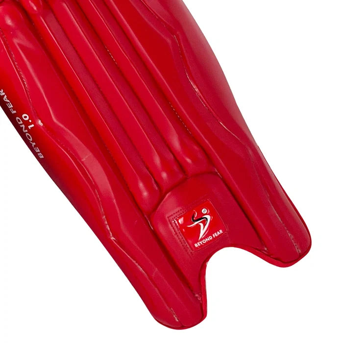 Instep and ankle section of DS T/20 Cricket Batting Pads Red showing durable bottom edge construction