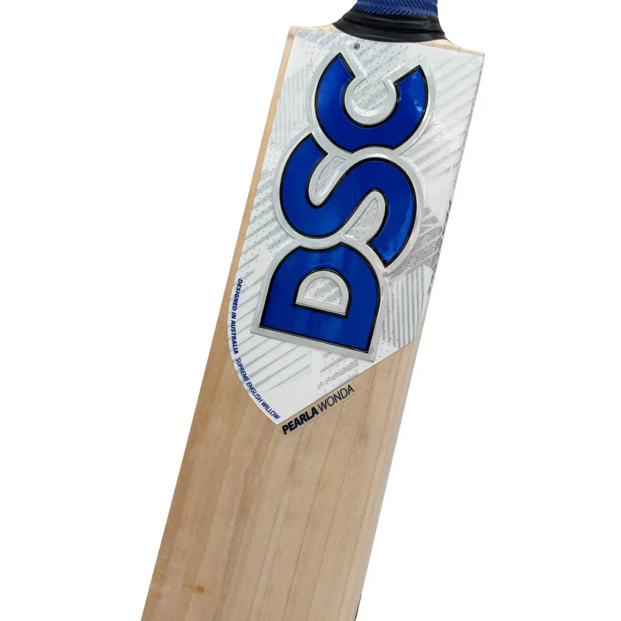DSC Pearla Wonda bat in a player's hands, showing grip and balanced pickup.