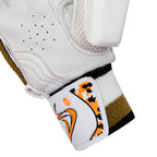 Close-up of the patterned wristband and strap closure on the DS D 1.0 WhiteGold youth cricket batting glove.