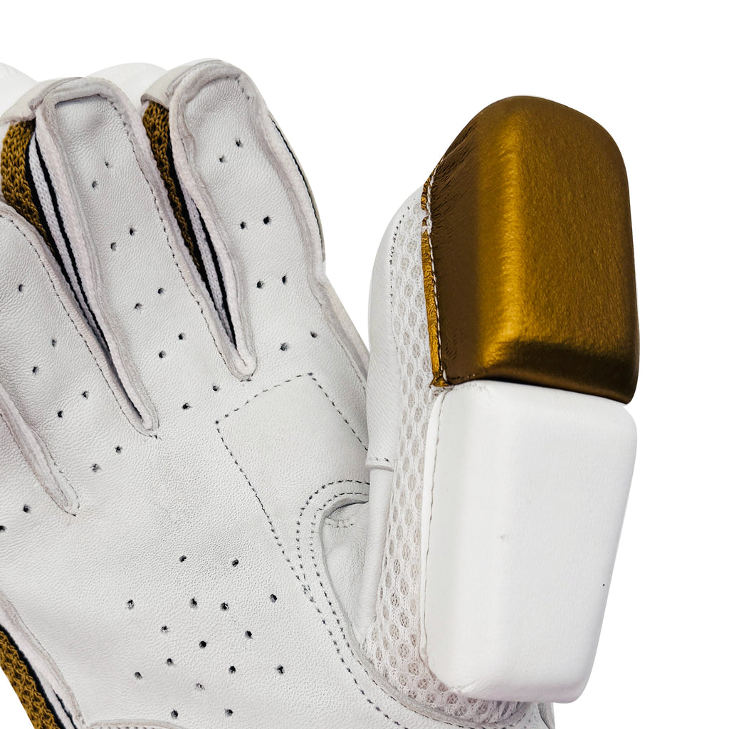 Close-up of the golden thumb pad and finger ventilation holes on the youth cricket glove.