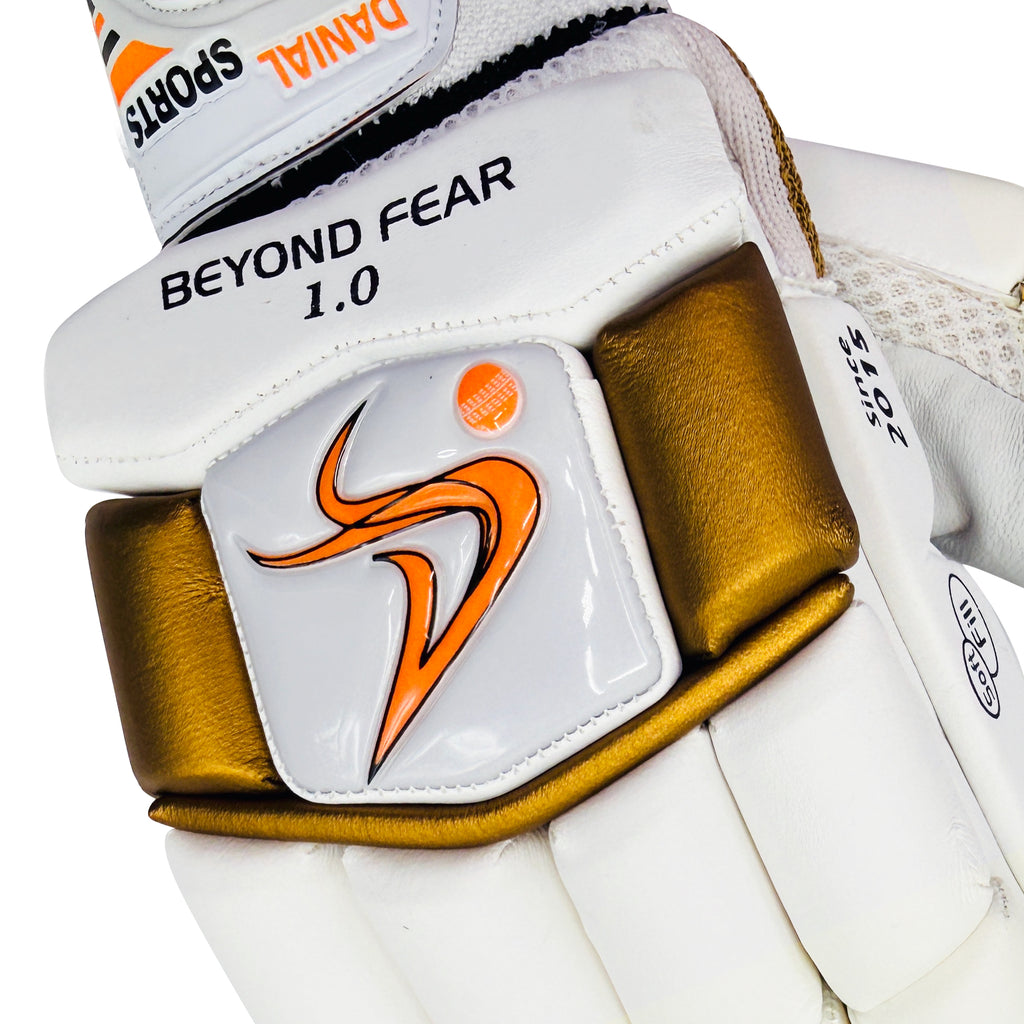 Front view of the DS D 1.0 WhiteGold batting glove highlighting the Beyond Fear 1.0 and Danial Sports logo branding.