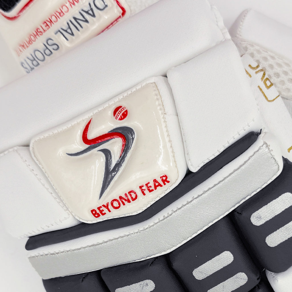 Close-up of the "Beyond Fear" logo and branding badge on the cricket batting glove.