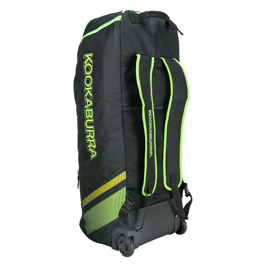 Kookaburra WD2000 Wheelie Duffle Bag being rolled in a cricket ground context.

