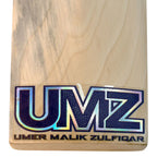 Ergonomic multi-piece cane handle of the MB Malik English Willow cricket bat fitted with a high-traction white textured grip.