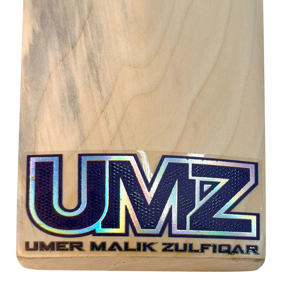 Ergonomic multi-piece cane handle of the MB Malik English Willow cricket bat fitted with a high-traction white textured grip.