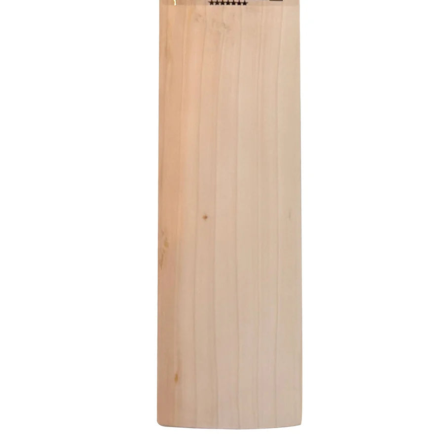 The MB Malik UMZ Vintage 7 Star bat resting on a grass pitch, emphasizing its classic nostalgic charm and modern playability frame.