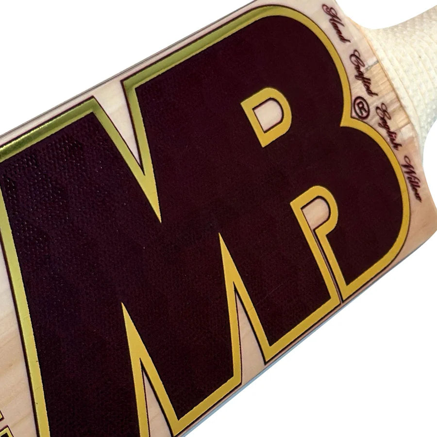 Zoomed-in shot of the retro-styled MB Malik Vintage 3-star edition decals and premium branding on the lower blade.