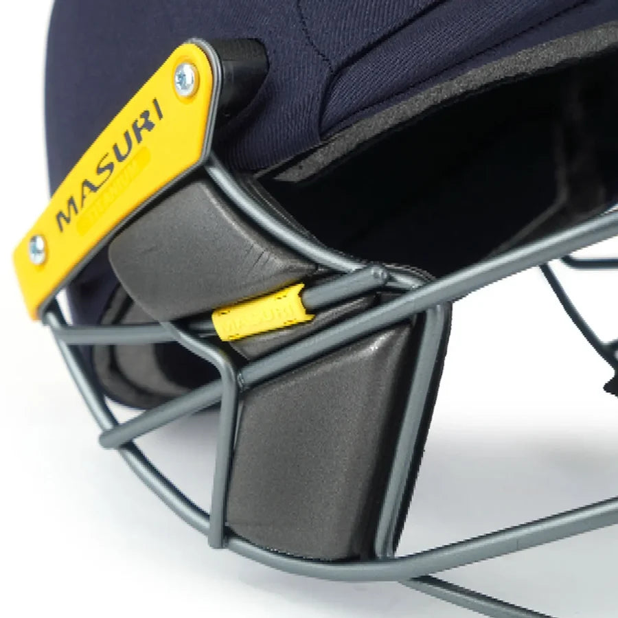 Inner shell view of navy Masuri T Line Titanium Cricket Helmet showing stemguard attachment area.