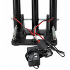 Full front perspective of black LED spring-loaded stumps connected to power adapter.