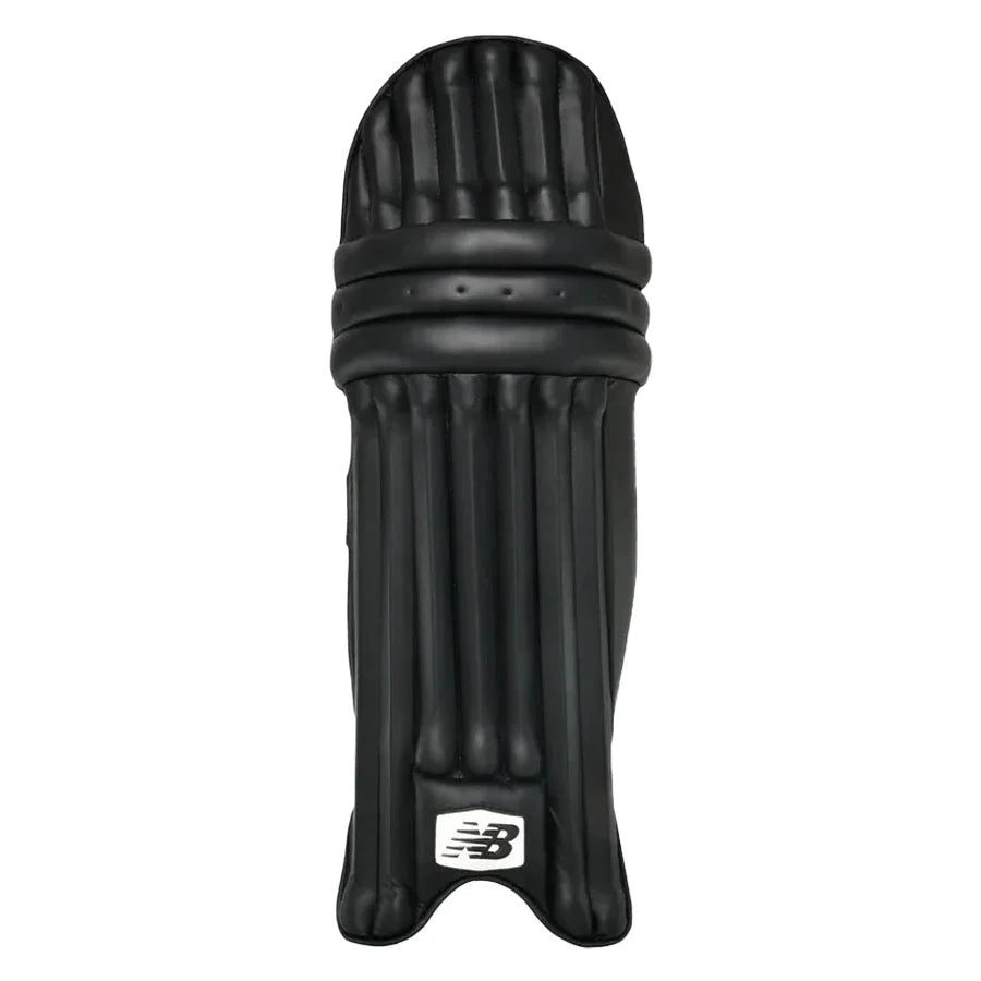 Detailed view of the padded knee cup locator and secure ankle support zones on the New Balance protective pads.