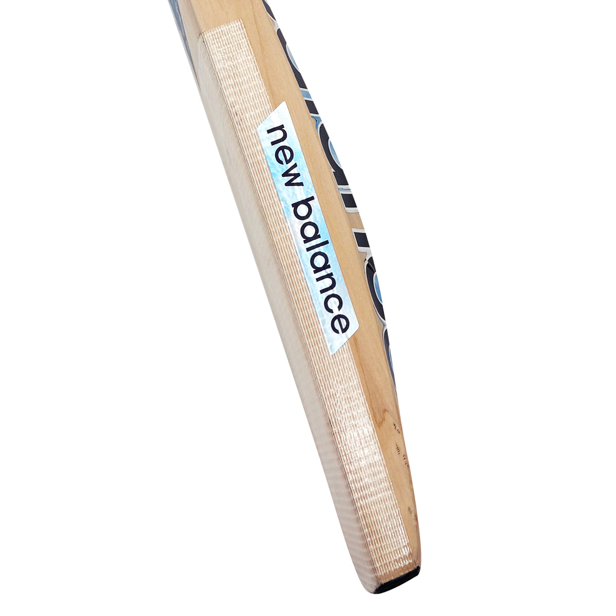 Close-up of the taped edge and side profile of the New Balance DC 370 Kashmir Willow cricket bat.