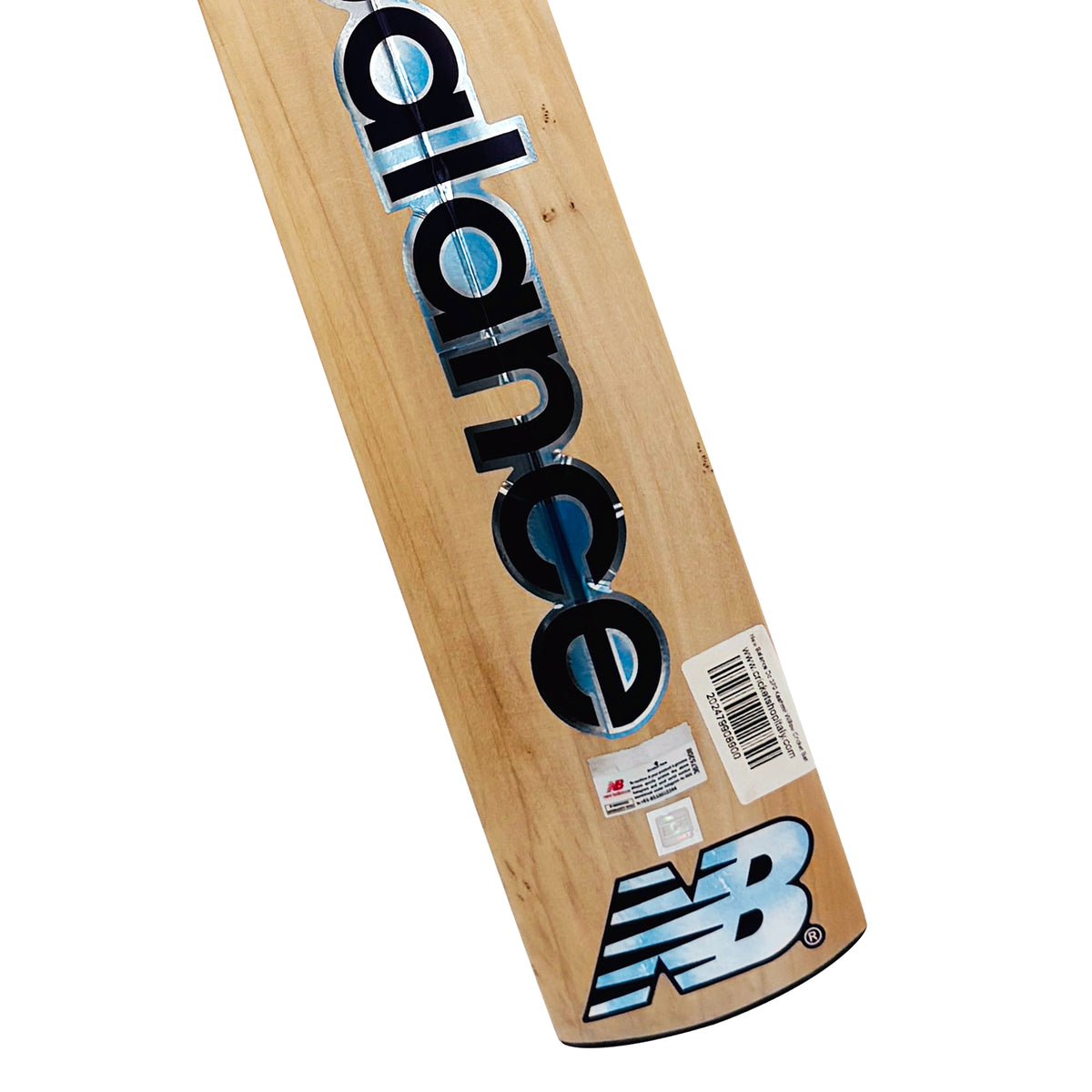 Close-up view of the toe area and back label of the New Balance DC 370 Kashmir Willow cricket bat.