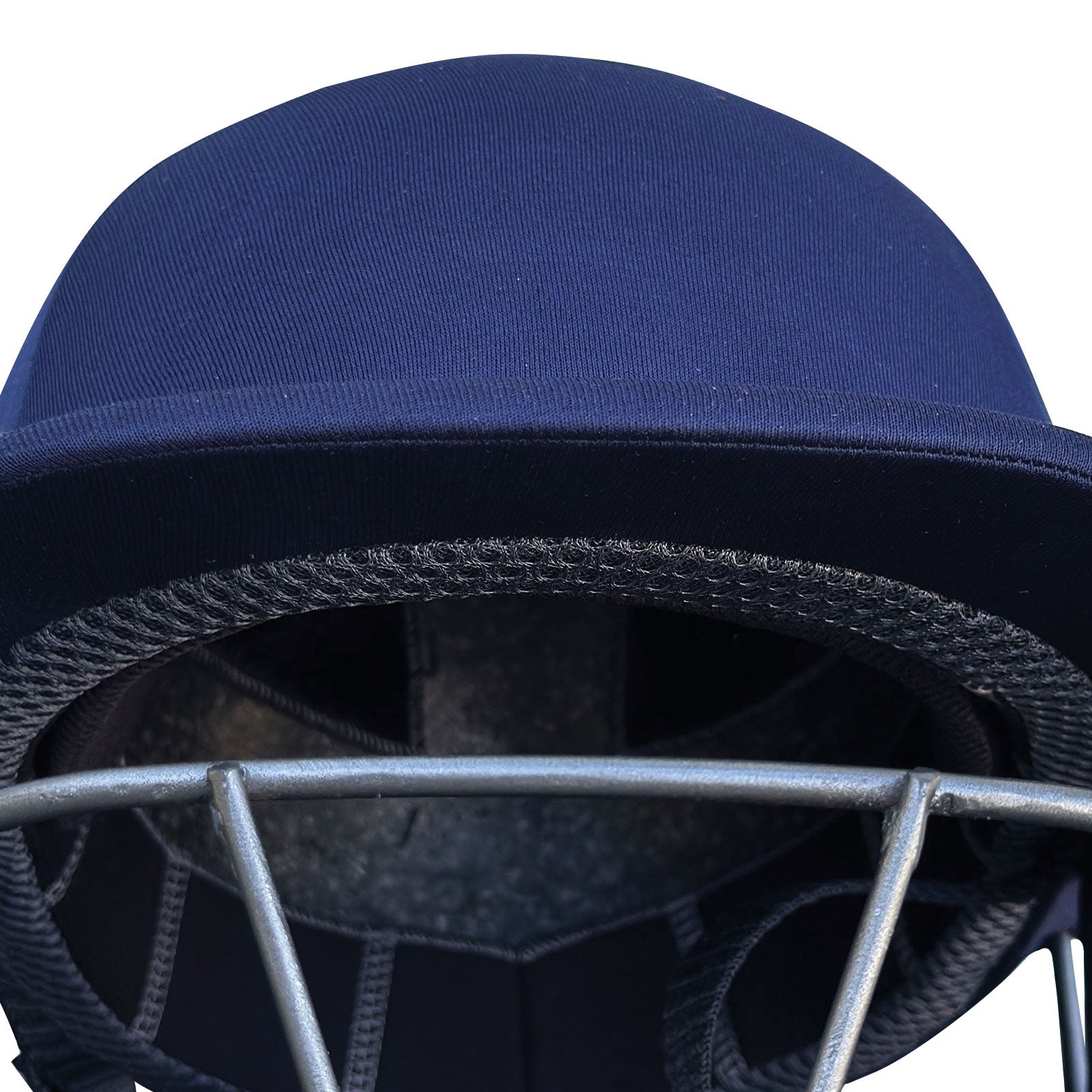 Macro shot of the textured surface mesh inside the top cooling vents of the NXT GEN pro cricket helmet.