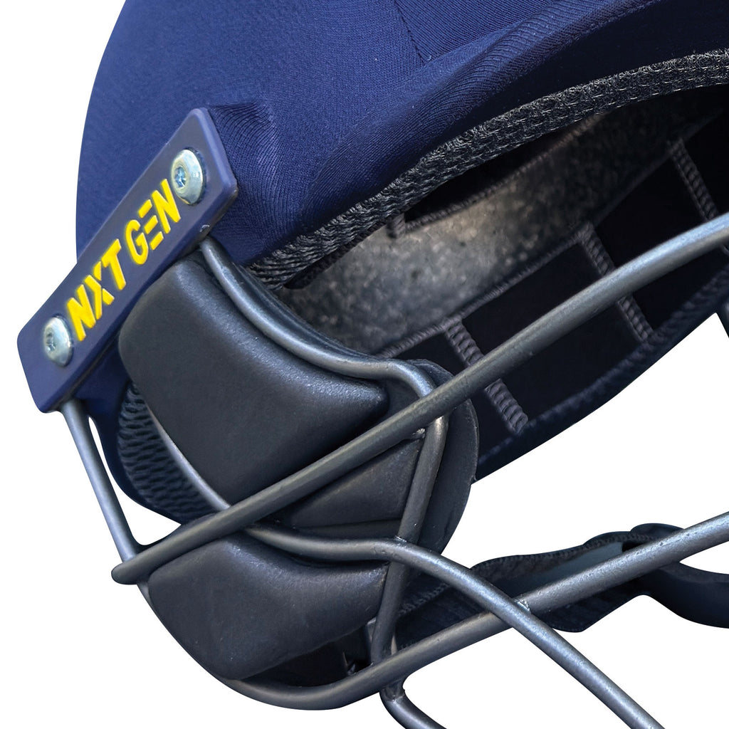 Close-up profile view of the navy blue fabric shell texture on the Next Generation Pro Max Cricket Helmet.