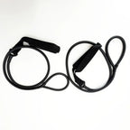Full view of two black resistance stretching bands coiled with foam handles on white background