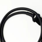 Detail of reinforced tubing loop and plastic connection joint on black fitness stretching band