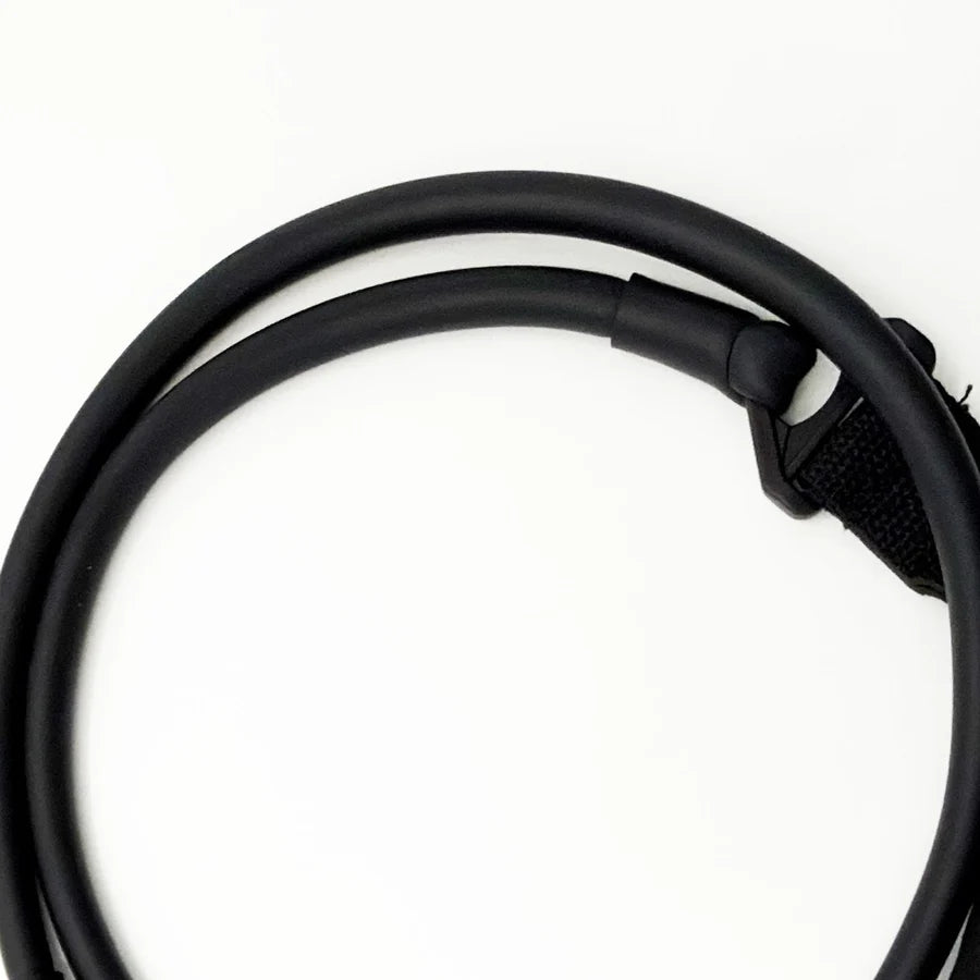 Detail of reinforced tubing loop and plastic connection joint on black fitness stretching band