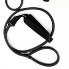 Coiled black exercise stretching band with foam-padded handle strap on white background