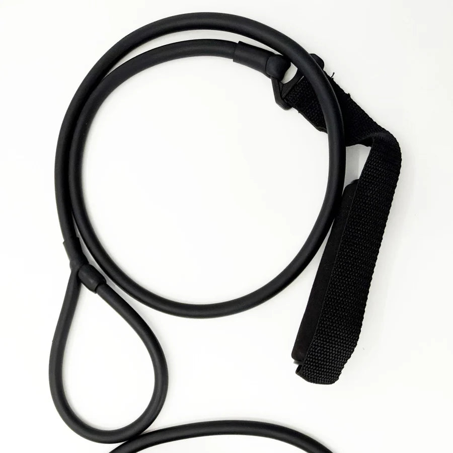 Black resistance stretching band arranged in loops showing rubber tubing and padded handle