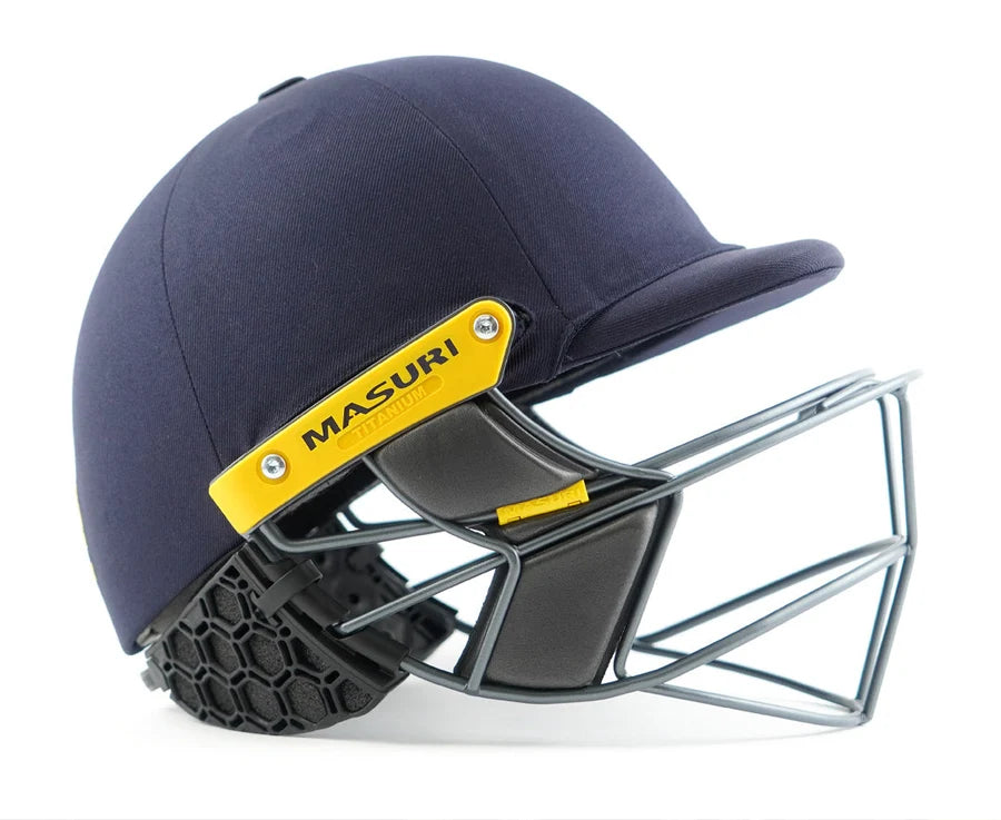 Close-up of black Masuri Stem Guard Pro attached to a navy helmet showing honeycomb structure.
