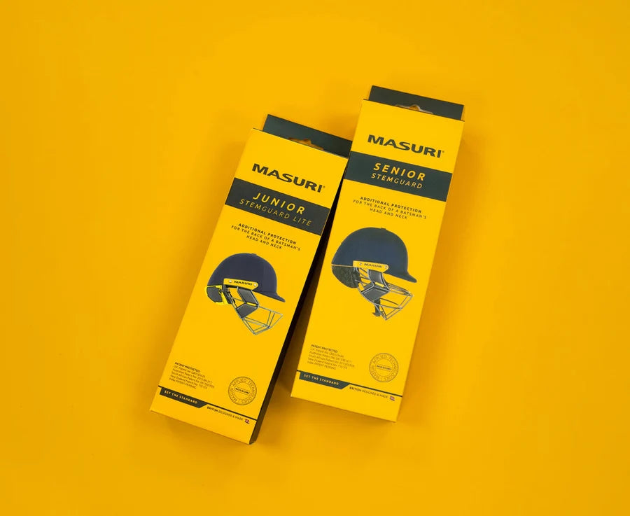 Hand holding yellow retail packaging box for Masuri Senior Stem Guard Pro.