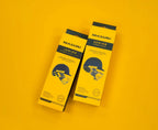 Hand holding yellow retail packaging box for Masuri Senior Stem Guard Pro.