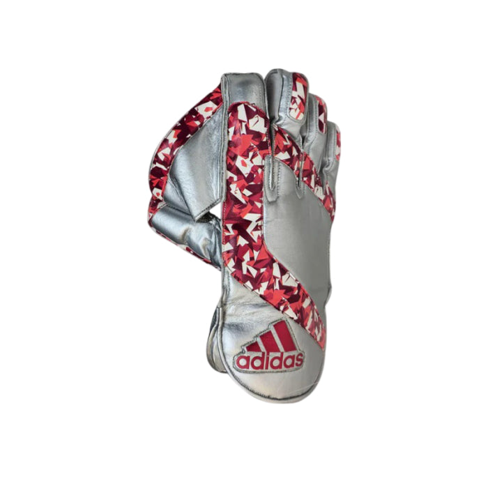Top perspective view showing the pre-curved shape and overall flexible profile of the Adidas Pellara 3.0 Wicket Keeping Gloves Adult.