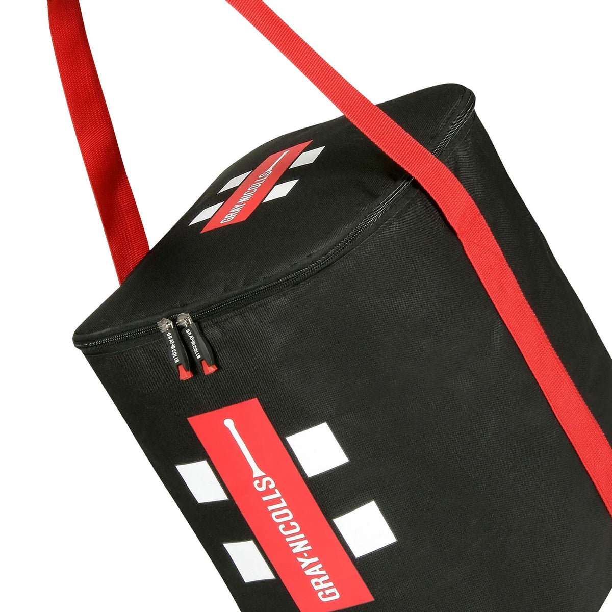 Side view of black Gray Nicolls Ball Bag showing the durable fabric, zip-top closure, and red shoulder strap.