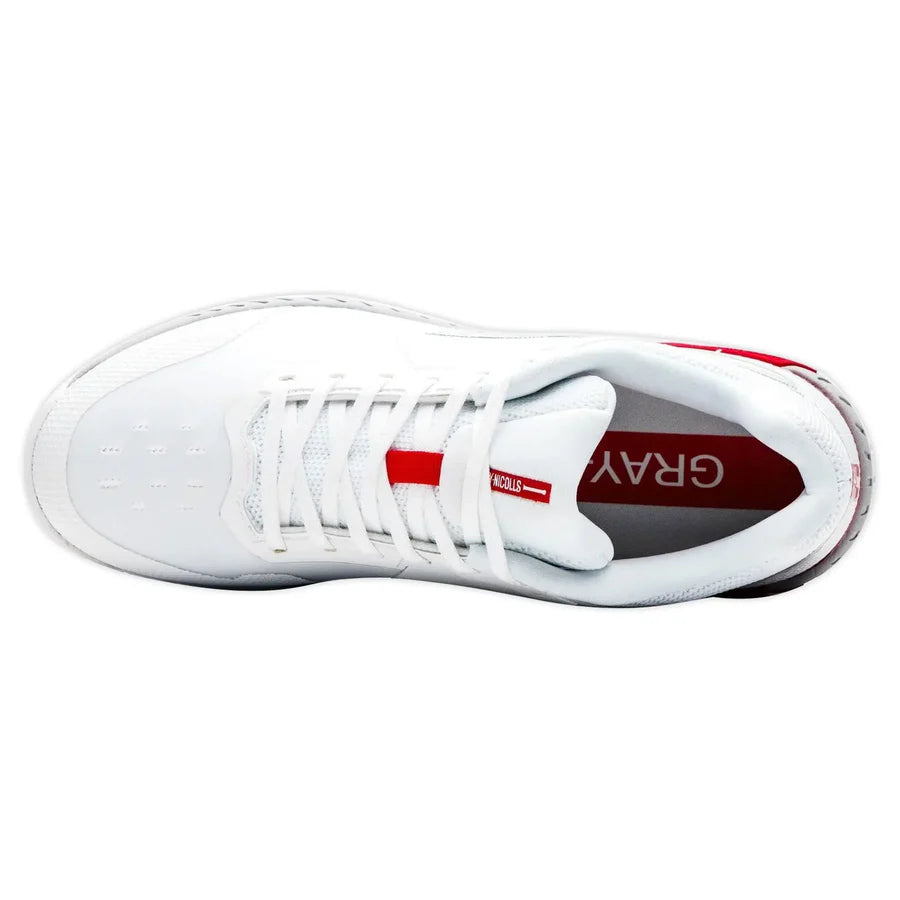 Close-up of the aggressive grip outsole with multi-directional spikes for perfect cricket traction.