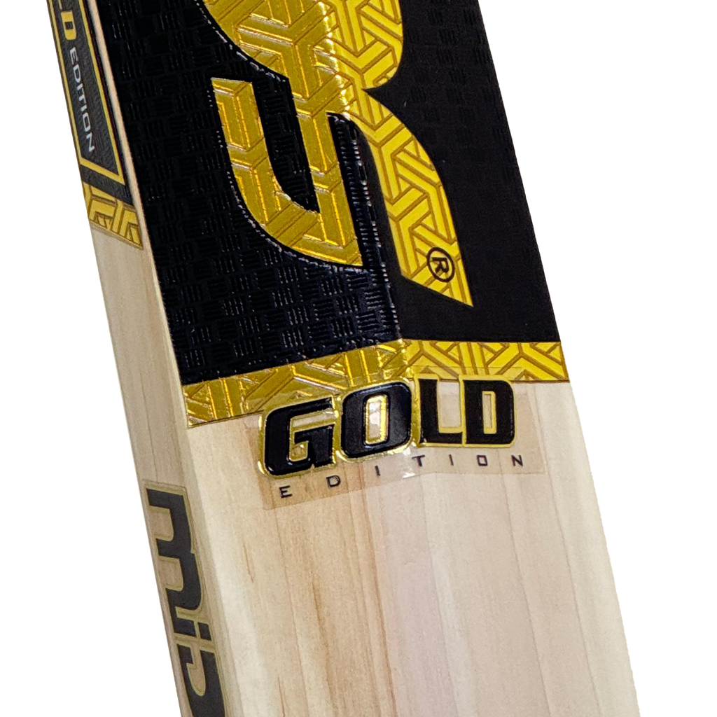 A player holding the Mids Gold cricket bat in a ready stance, showing its proportional size and balance.

