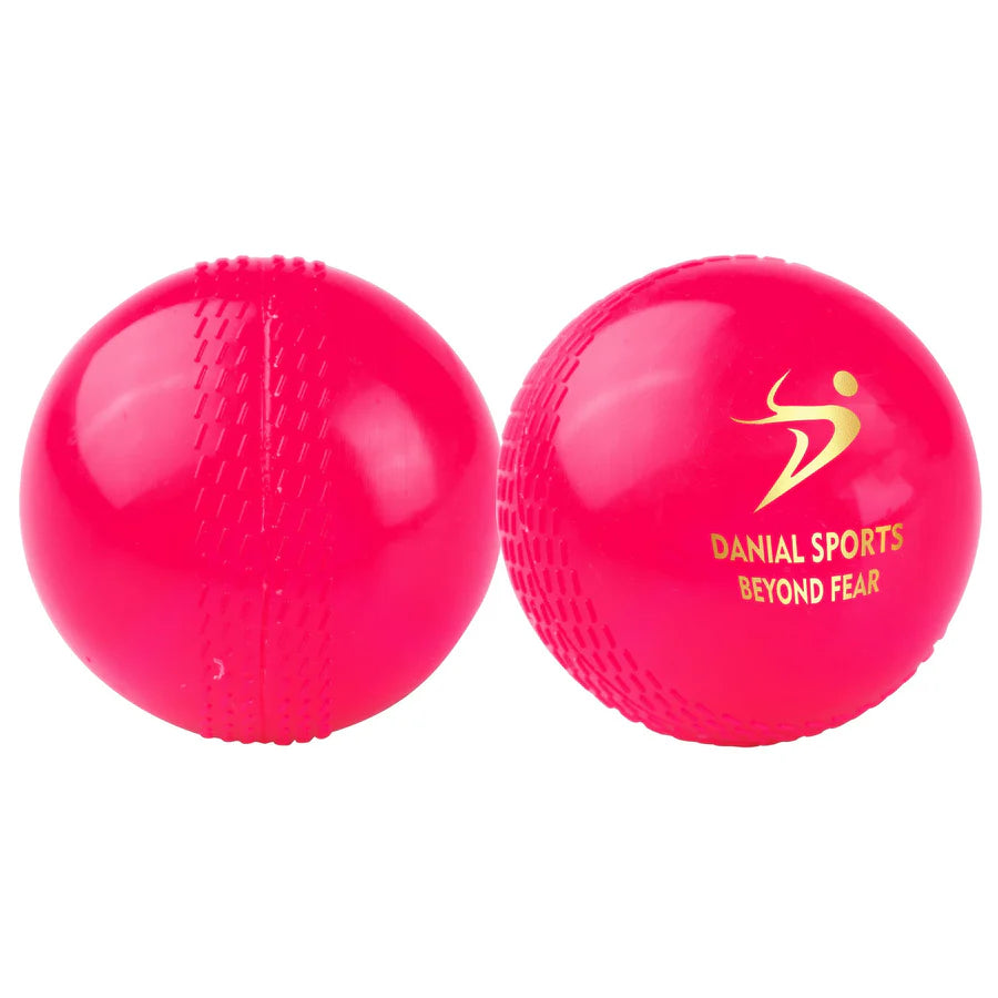 Bright pink Wind Cricket Ball showing gold Danial Sports logo and embossed seam pattern