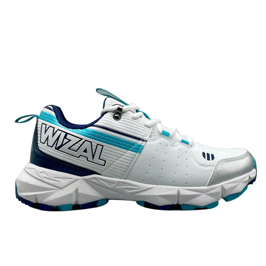 Close-up of the textured sole gripper spikes on the WIZAL Strike Cricket Shoes for turf play traction