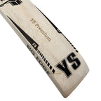 Close-up of the YS brand logo sticker printed on the front shoulder of the soft ball cricket bat